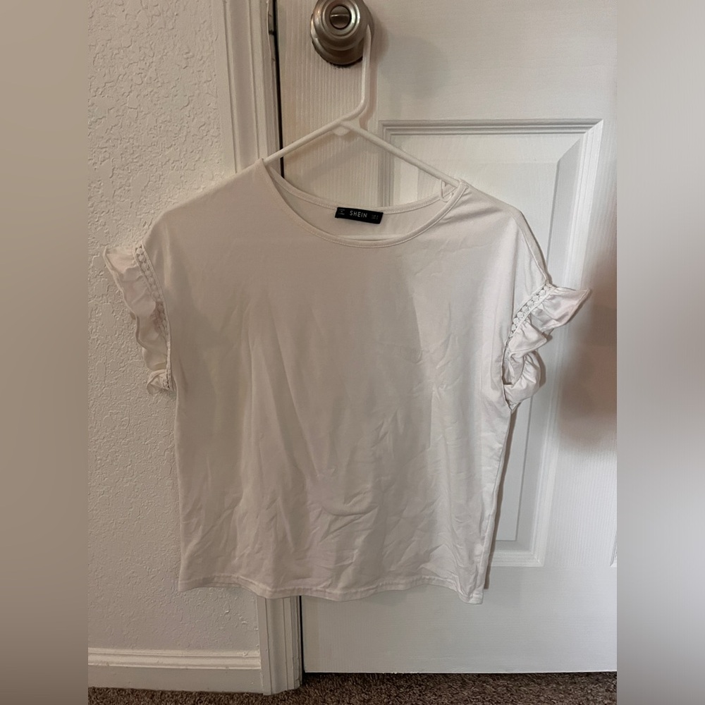Small white ruffled sleeve blouse. Size small.